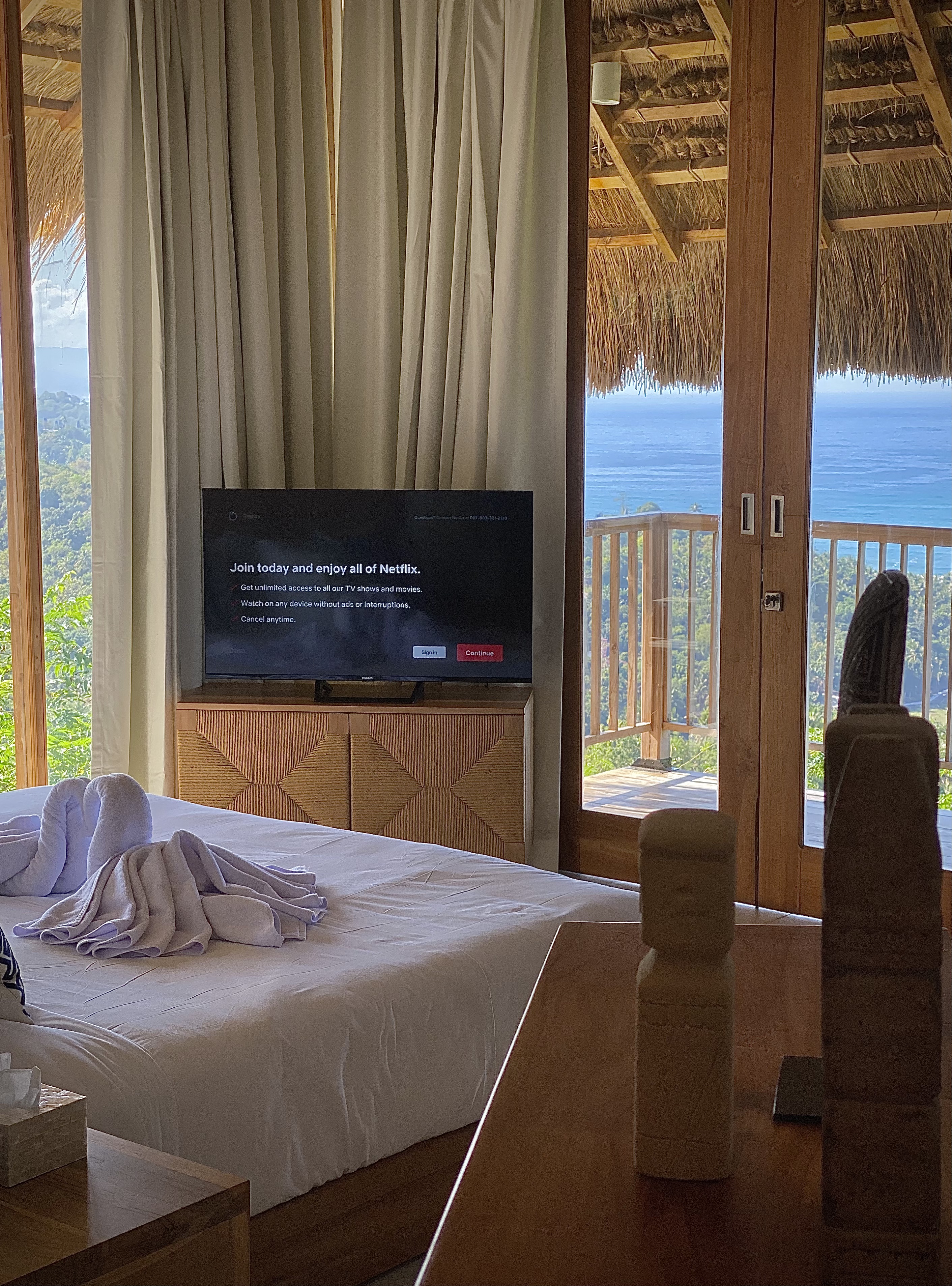 Bedroom with television and sea view